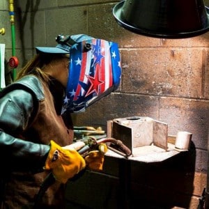 Brie Jenkins works in the welding lab