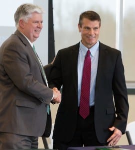 MSSU President Dr. Alan Marble (left) and Dr. Steven Bishop, OTC provost and vice chancellor for academic affairs, shake hands after articulation agreement is signed.