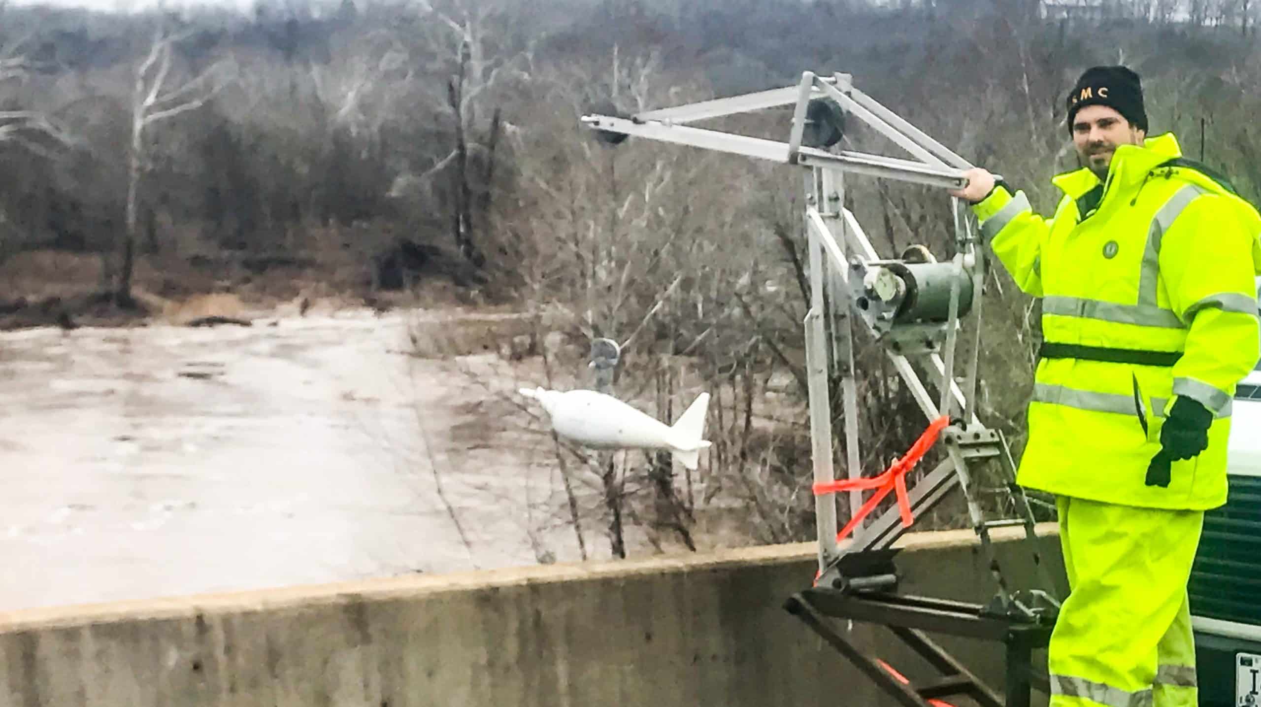 Charlie Smith tests water on the job for the U.S. Geological Survey