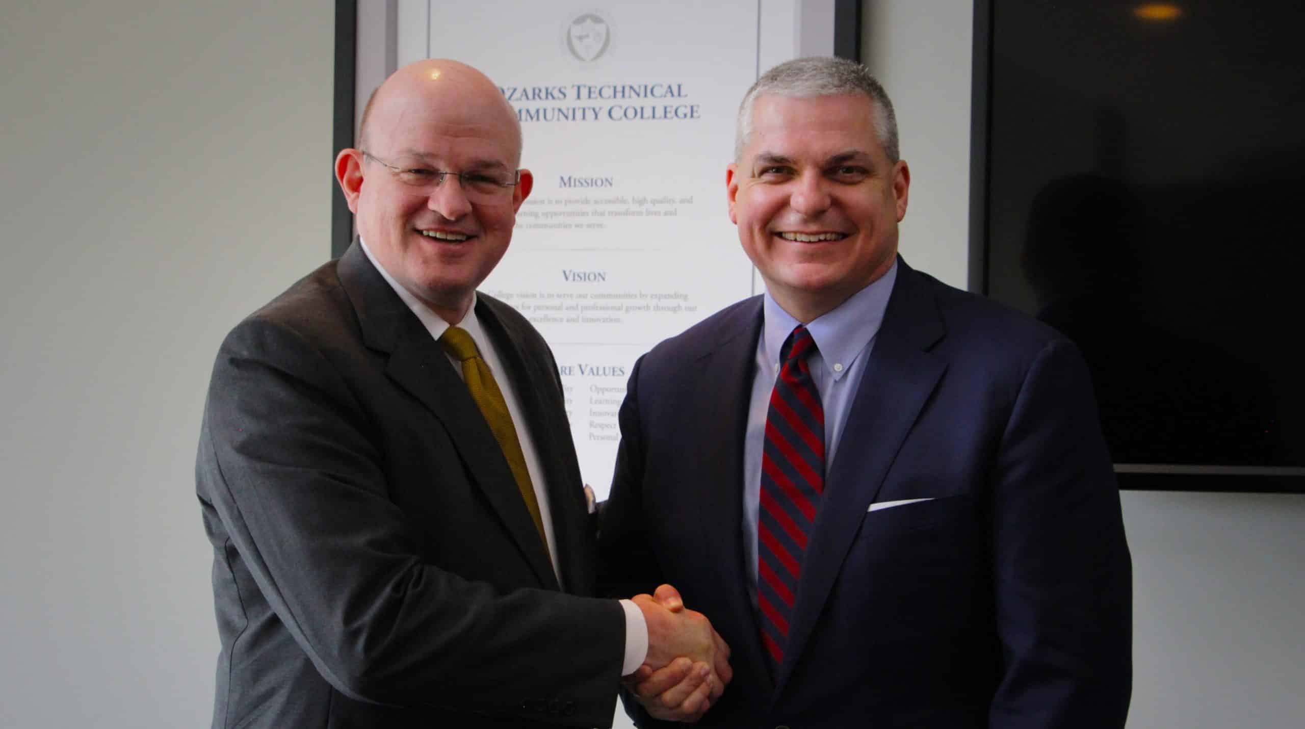 photo of OTC Chancellor Hal Higdon (left) and SBU President Eric Turner (right)