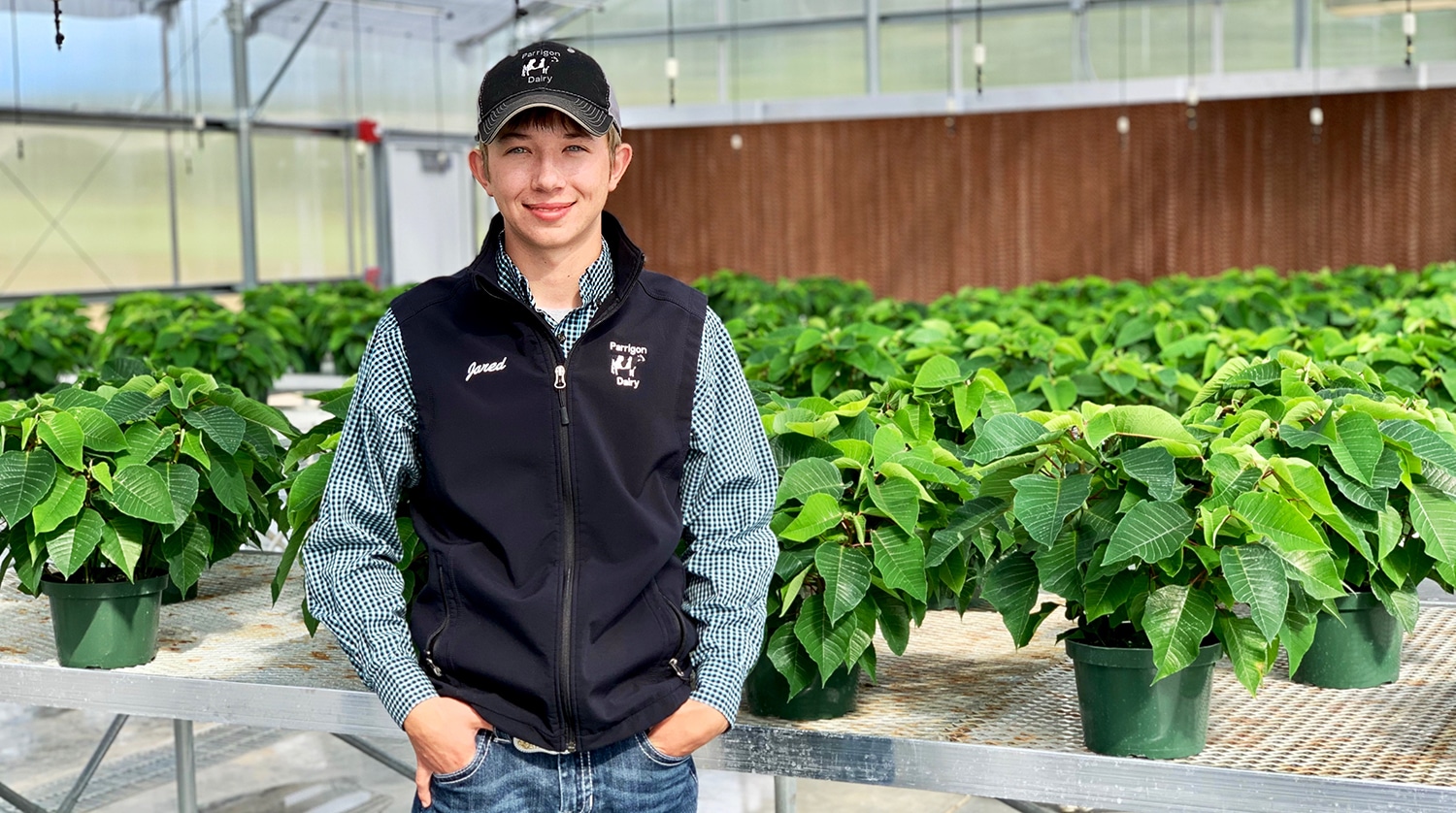 OTC ag student Jared Parrigon stands in the college's greenhouse