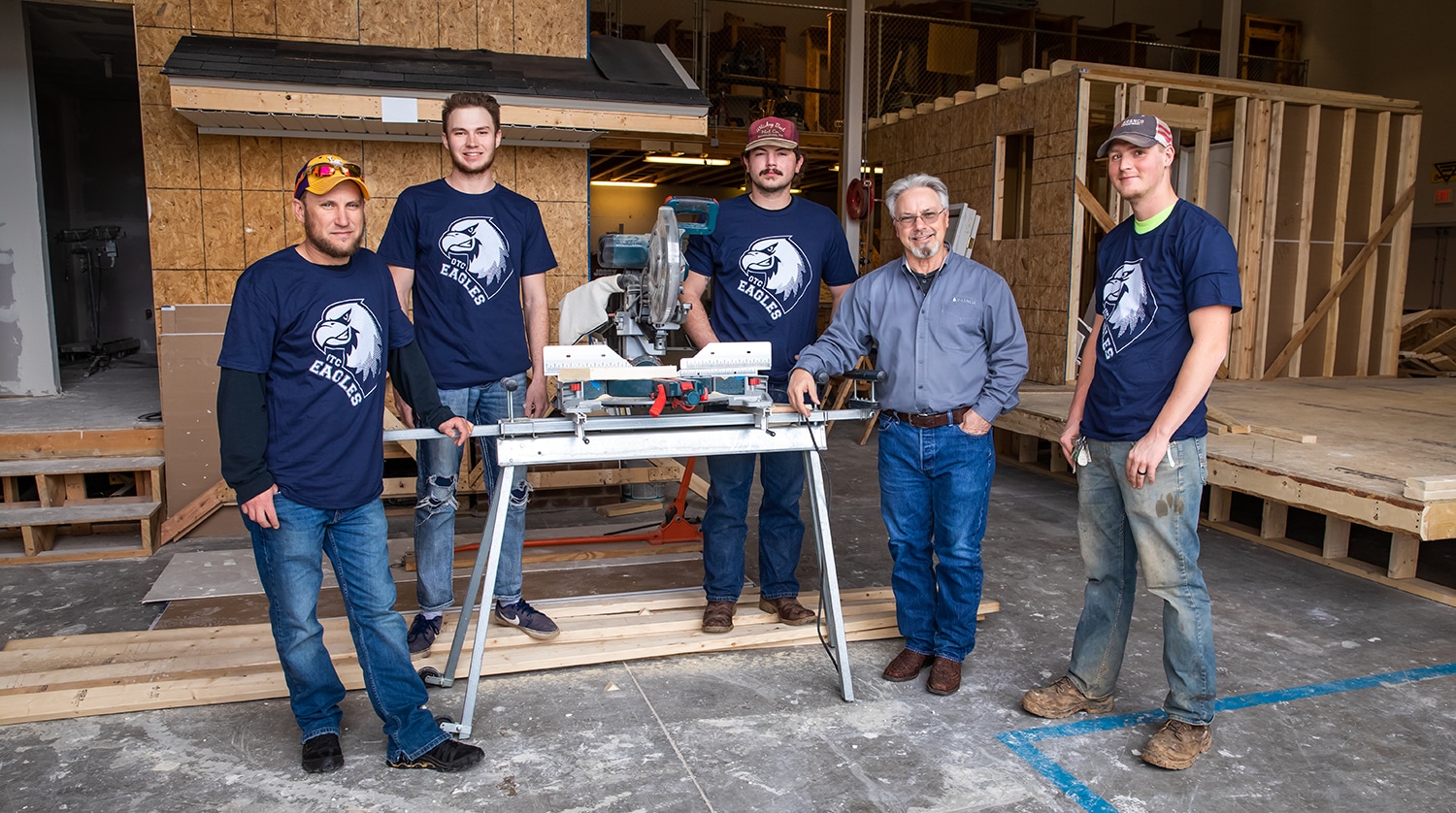 Branco apprentices pose in OTC's construction lab