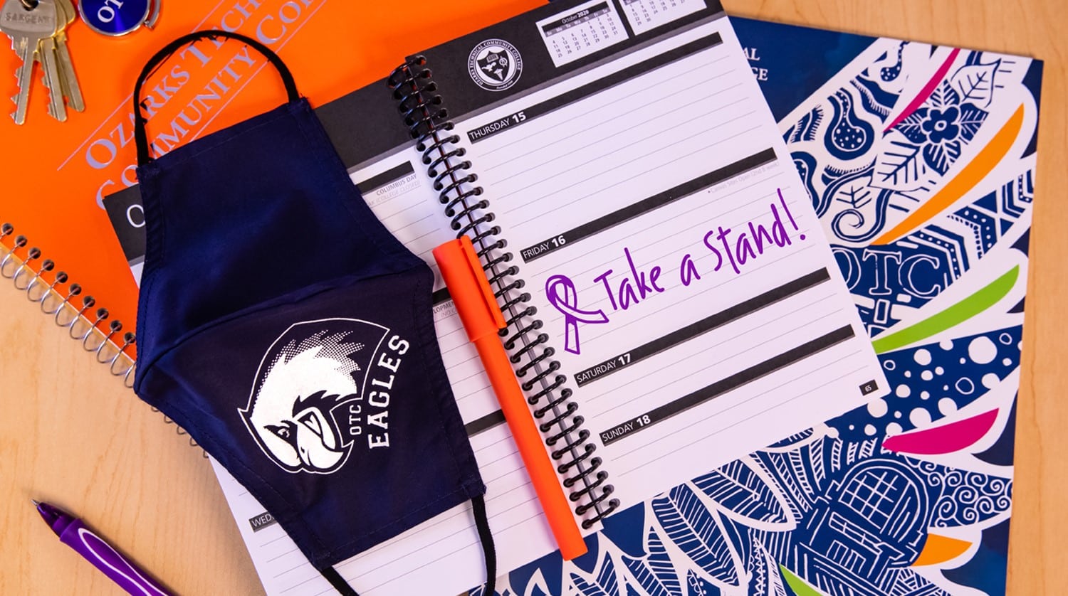 OTC planner with "take a stand" written on the page