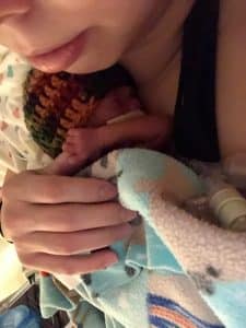 Whitney La holds her micro preemie in the hospital for the first time