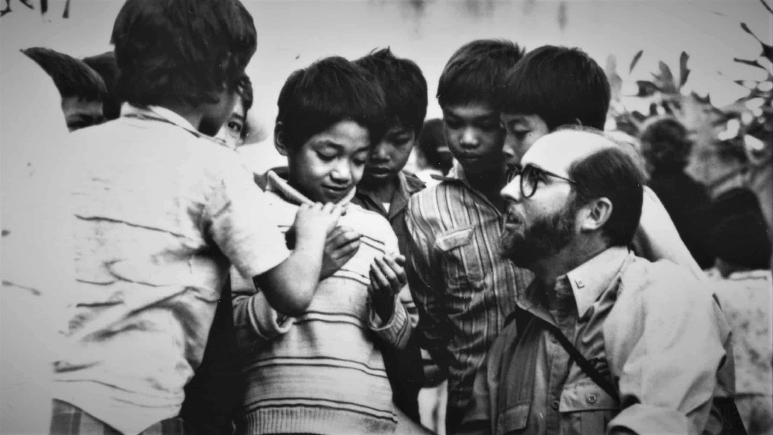 Larry Rottman with Vietnamese children